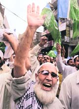 Activists of Jamaat-e-Islami chant anti-government and anti-US slogans during a protest in Peshawar on Friday.