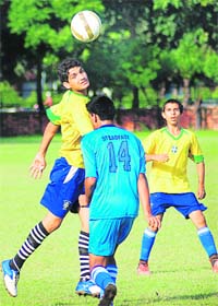 A football match in progress between Haryana Football Association and Steadfast Football Academy, Mumbai, at the Sector 17 football stadium