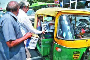 Traders collect money for Bihar flood victims at Chandni Chowk in New Delhi on Saturday. 