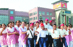Students of a local government school come out of a multiplex in Jalandhar after watching a film