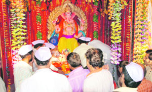 People offer prayers to Lord Ganesha in Jammu on Saturday.