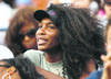 Venus Williams watches her sister Serena Williams of the U.S. play Dinara Safina of Russia during their semifinal match at the U.S. Open.