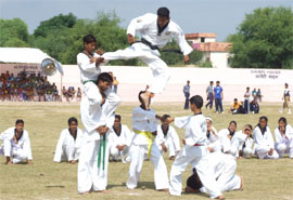 Students of Kendriya Vidyalaya exhibiting martial art during the opening ceremony of the Regional Athletics Meet at KV-1, Bathinda Military Station, on Sunday.
