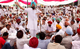 Congress MLA from Rampura Phul Gurpreet Singh Kangar addresses the meeting at Bhai Rupa village in Bathinda district on Sunday.