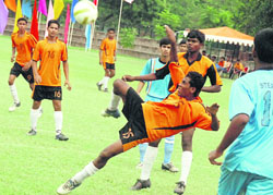 Spirits soar high during a match of the Sixth Administrator's Challenge Cup All-India Football Tournament at the Sector 17 football stadium on Sunday.