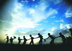 Way to go: Out to have fun, children form a train adjacent to the rail track near Sector 47 in Chandigarh on Sunday.