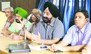 State president of Indian Medical Association Dr Amrik Singh Arora addresses a press conference in Ludhiana on Sunday. 