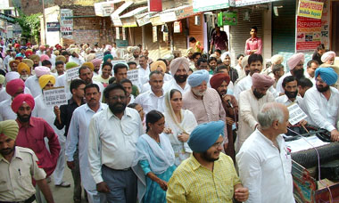 Congress leaders making request to shopkeepers to roll down shutters to make the bandh call successful, which was given by Jagmeet Singh Brar, to restore democracy in Muktsar on Monday. Jagmet Singh Brar, Gursant Singh Brar, Gurdas Girdhar and other Congress leaders are also seen in the picture.