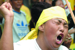 A Tibetan activist protests against the visit of Chinese foreign minister Yang Jiechi to India in New Delhi on Monday.