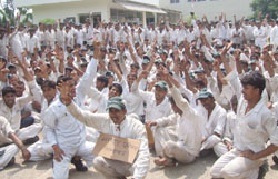 Honda company workers voice their demands during a strike at IMT Manesar. 