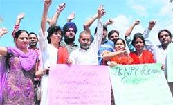 Panthers Party acitivists hold a demonstration seeking relief for the victims of the land row agitation in Jammu on Monday