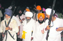 Agitators brandish firearms in Malout, where they clashed with followers of the Divya Jyoti Jagriti Sansthan on Monday.