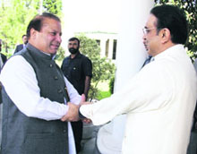 Newly elected Pakistan President Asif Ali Zardari of the Pakistan Peoples Party greets former coalition partner Nawaz Sharif in Islamabad on Monday.