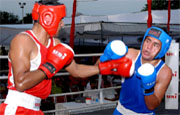 Kuldeep Singh of Punjab (Red) and Devraj of UTK (Blue) exchange blows during a match