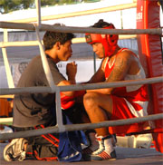 A boxer getting tips during a match