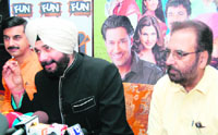 MP Navjot Sidhu makes a point at a press conference with Manmohan Singh, the director of film Mera Pind  My Home.