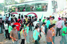 First-year students board the bus hired for them after watching a movie in PVR cinema on Tuesday.