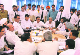 Sessions judge G.K. Rai hears cases during a pre-lok adalat at the district courts complex in Ludhiana on Tuesday.