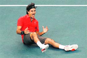 Roger Federer of Switzerland reacts after defeating Andy Murray of the United Kingdom to win the 2008 U.S. Open Men's Championship