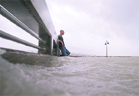 A resident stands on the pier in Key West Florida, as Hurricane Ike passes to the south on Tuesday. Ike blew through the warm Caribbean Sea towards western Cuba and the Gulf of Mexico oilfields after ripping the eastern side of the Island, with high winds and torrential rains that left a broad path of destruction. 