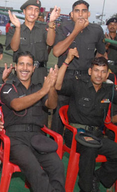 Armymen cheer boxers during a bout at the sports stadium in Bathinda on Wednesday