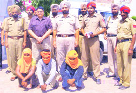 The three suspected robbers in police custody at Raikot on Wednesday.