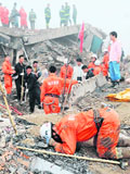 Rescue personnel search for survivors in a building after a mud-rock flow in Xiangfen County under Linfen City north Chinas Shanxi Province