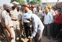 Cops investigating the scene of the crime in Amarpura