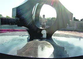 A municipal corporation worker does his bit to spruce up the War Memorial in Sector 3, Chandigarh