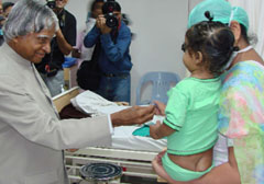 Former President APJ Abdul Kalam meets 14-month-old Khusmeet Singh, the youngest liver transplant recipient, at the Army Hospital in New Delhi on Wednesday.