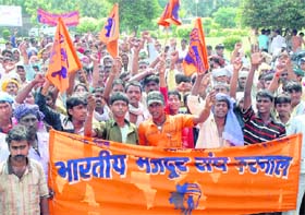 Members of the Rice Mills Contract Labour Union hold a demonstration in Karnal