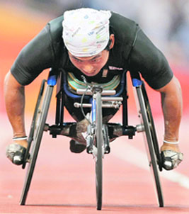 South Koreas Hong Suk-Man crosses the finish line in the men's 400m T53 final at the Beijing Paralympic Games on Thursday.