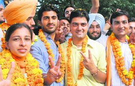 Winners of PU student elections flash victory signs