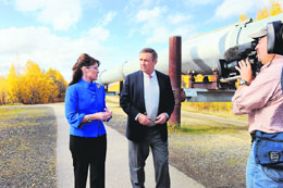Republican vice-presidential nominee Alaska Governor Sarah Palin (left) talks to Charles Gibson while walking alongside the Trans-Alaska Pipeline during an interview in Fairbanks, Alaska, on Thursday.