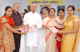 Students of MA (Hindi), who figured in the Panjab Universitys merit list this year, receiving awards from former MP Virendra Kataria in Abohar on Saturday.