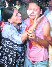 An injured girl being taken to RML Hospital in New Delhi