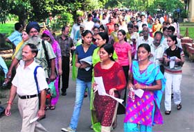 Students come out of the examination hall after the CET exam in Jammu
