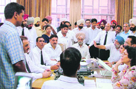 Justice Mehtab Singh Gill of the Punjab and Haryana High Court hears litigants during a special lok adalat held at district courts in Ludhiana on Saturday.