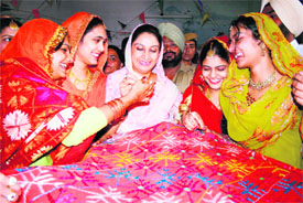 Students with Harsimrat Kaur Badal at Ramgarhia College in Ludhiana on Saturday.