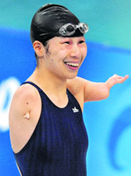 Jiang Fuying of China smiles after winning the womens 100m butterfly S6 final during the 2008 Beijing Paralympic Games.