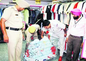 Policemen carry out a check at a mall in Ludhiana