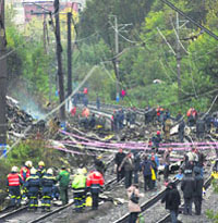 Firefighters and investigators work at the site where a Russian airliner crashed on a railway track outside Perm on Sunday. The Russian Boeing 737-500 airliner crashed near the Ural mountains.