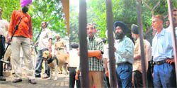 A dog squad of the UT police carries out search at Punjab mini secretariat, Sector 9, Chandigarh, and (right) employees await anxiously outside the building