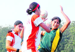 Handball match in progress between Dev Samaj College for Women, Ferozepur city, and GGS Khalsa College for Women, Jhar Sahib, at PU ground