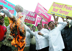 Activists of the Akhil Bharatiya Muslim Yuva Ekta Committee protest against terrorism in New Delhi on Monday. 