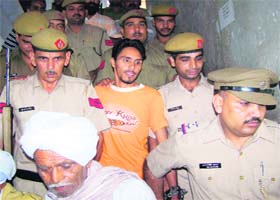 Dharminder Singh, an accused in the case relating to the bomb attack on the cavalcade of the Dera Sacha Sauda chief, is produced in a Karnal court