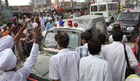 Residents of the Dhobiana Basti block traffic outside the bus stand in Bathinda