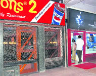 It was shutters down for Hot Millions outlets on Wednesday as IT men conducted raids on their business