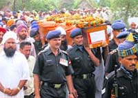 Army men carry the casket containing the body of Havildar Swarnjeet Singh in Ambala on Wednesday.