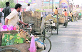 Rehris line up to throw garbage on the bank of Budda Nullah in Ludhiana